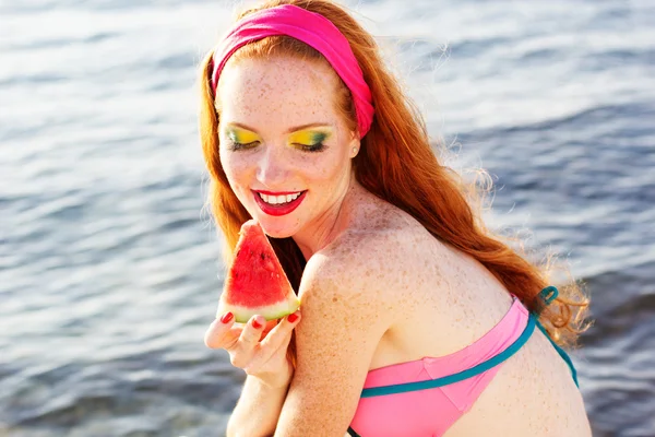 Smiling girl with freckles holding watermelon — Stock Photo, Image