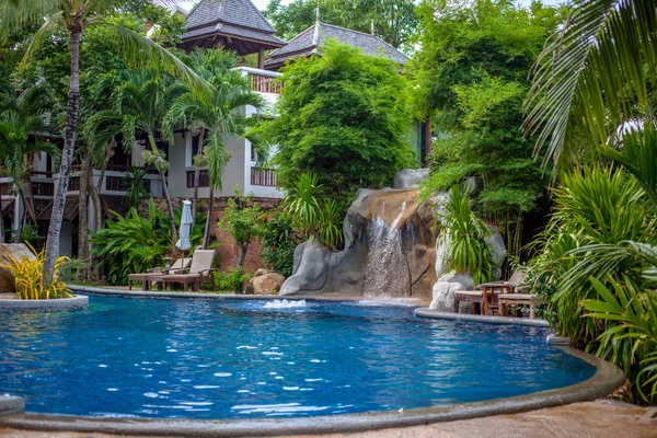 Tropical waterfall landscape in spa resort
