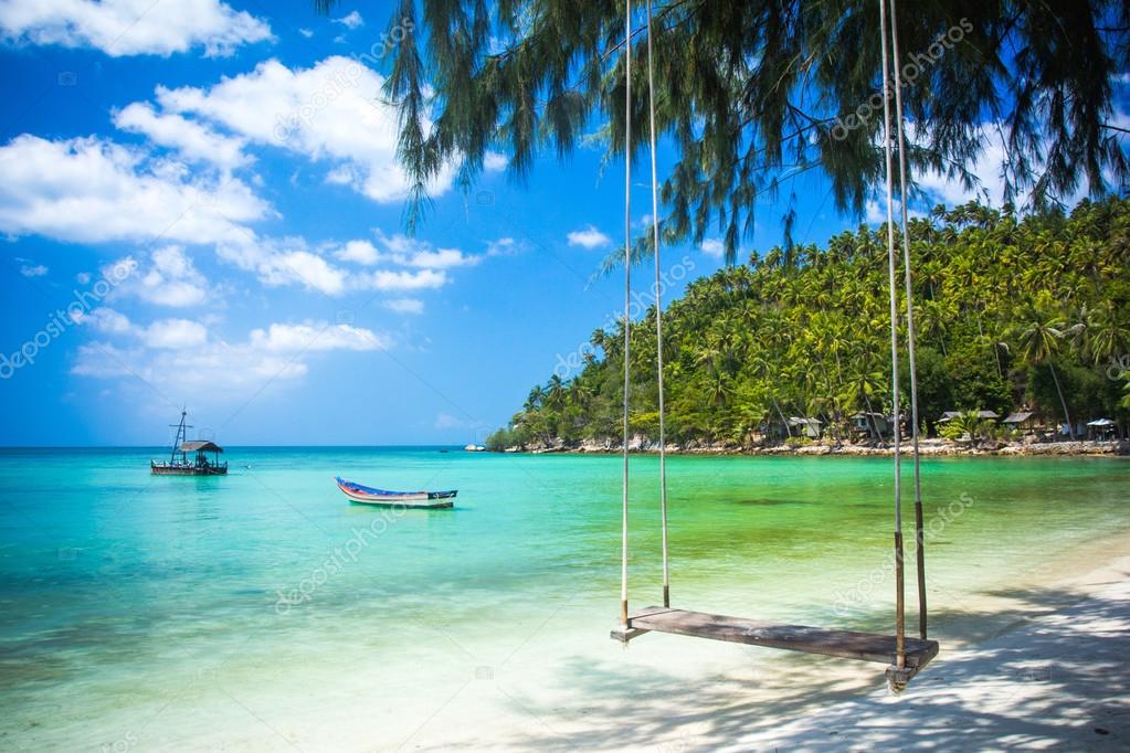 Swing hang from coconut tree over beach, Phangan island ,Thailand Stock