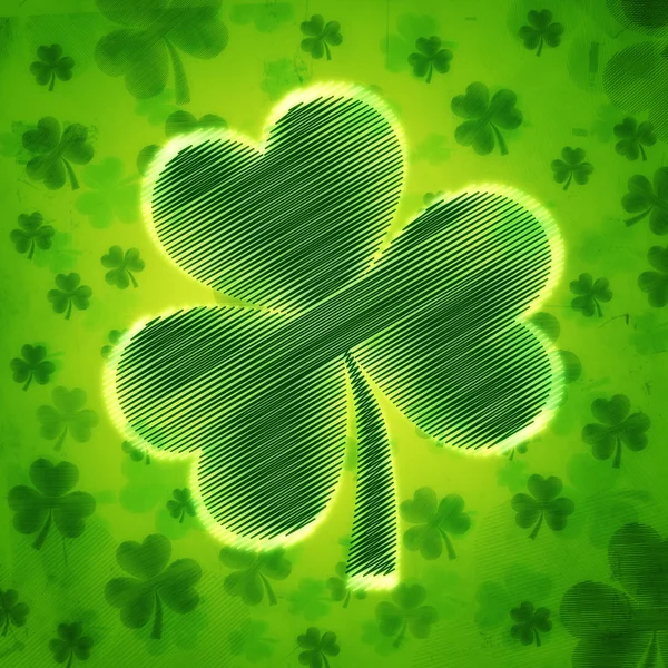 Großer gestreifter Shamrock in grünem altem Papierhintergrund mit Blumen — Stockfoto