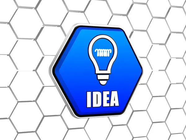 Ideia e símbolo lâmpada em hexágono azul — Fotografia de Stock