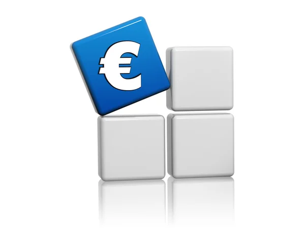 Euro sign in blue cube on grey boxes — Stock Photo, Image