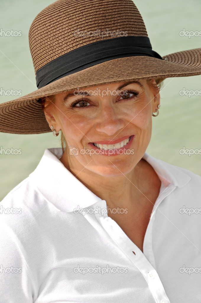 Attractive Woman Wearing a Brown Summer Hat