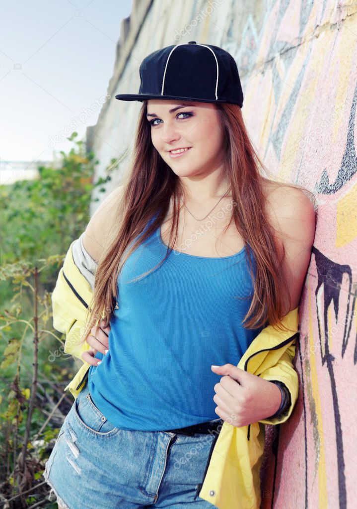 Teenager Girl Posing near Wall