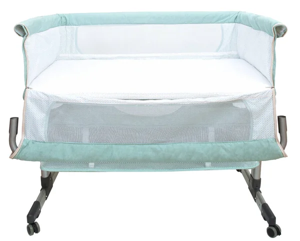 Baby bassinet travel cot co-sleeper, isolated over white 图库图片