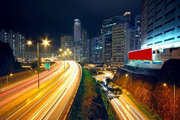 Urban area dusk, busy traffic — Stock Photo, Image