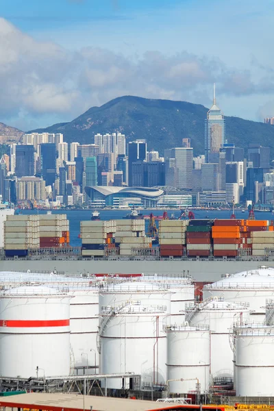 Huge Oil tanks and ship in city at day — Stock Photo, Image