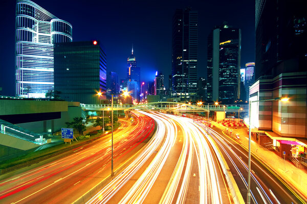 Colorful city night with lights of cars motion blurred in hong kong