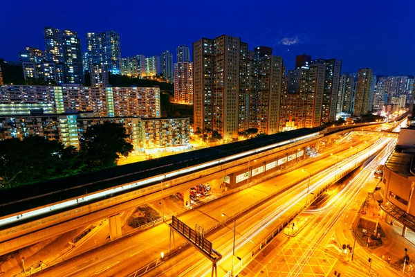 Busy highway train traffic night in finance urban — Stock Photo, Image