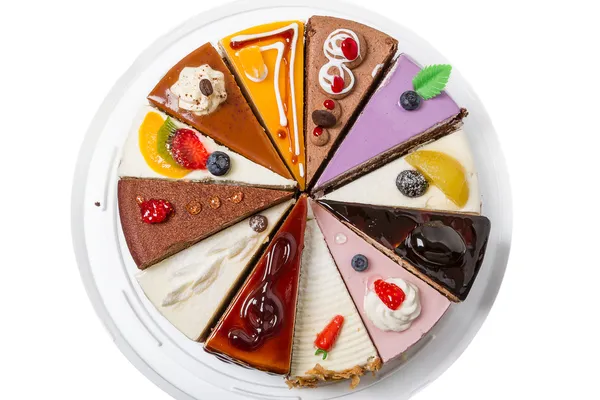 Doze pedaços diferentes de bolo — Fotografia de Stock