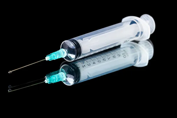 Syringe on black — Stock Photo, Image