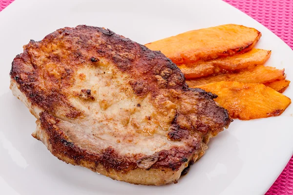 Roast pork on white plate — Stock Photo, Image