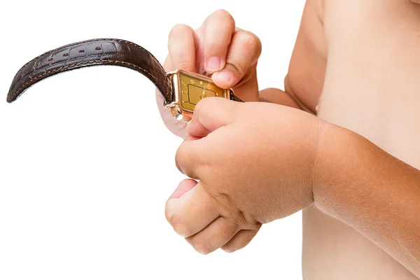 Niño con un reloj de oro —  Fotos de Stock