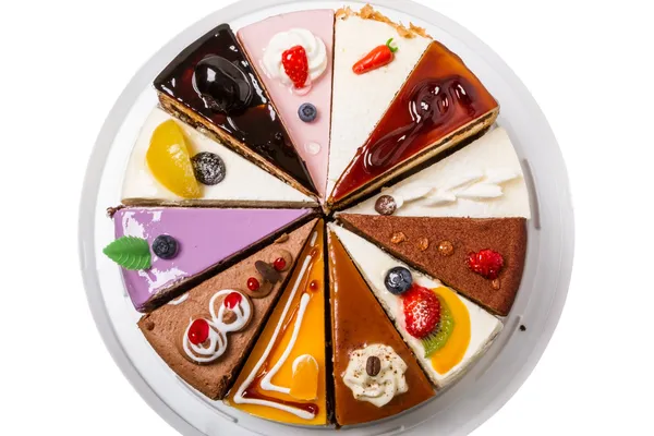 Diferentes pedaços de bolo vista superior — Fotografia de Stock