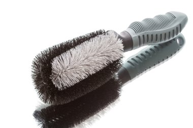 Brush for cleaning the car wheels clipart
