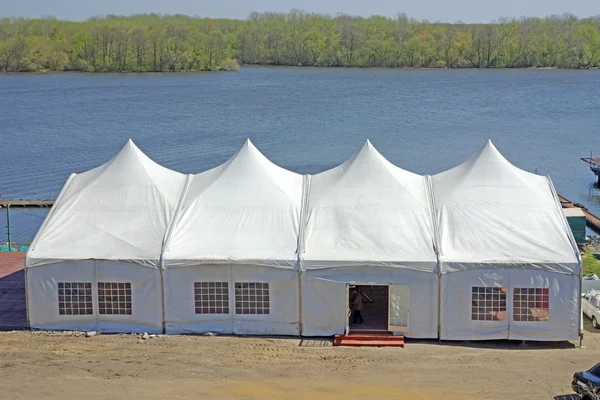 Big tent by the river — Stock Photo, Image