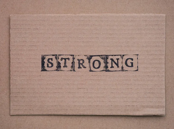 Cardboard Word Strong Made Black Alphabet Stamps — Stock Photo, Image