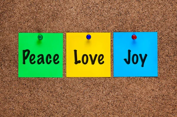 Three Colored Notes Corkboard Words Peace Love Joy — Stock Photo, Image