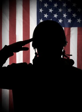 American (USA) soldier saluting to USA flag clipart