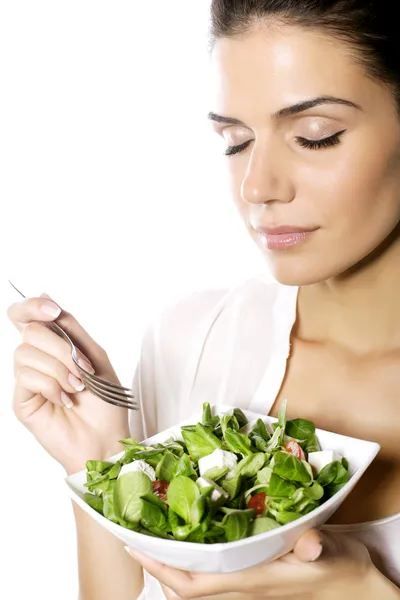 Happy woman eating healthy vegetable salad Royalty Free Stock Images