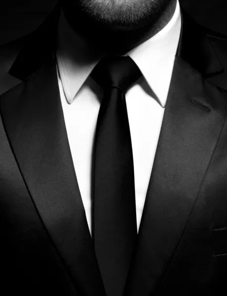 Gentleman in black suit and tie — Stock Photo, Image