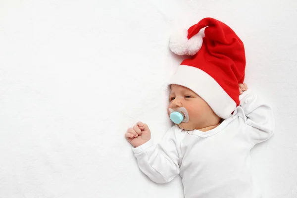 Dítě s santa claus klobouk — Stock fotografie