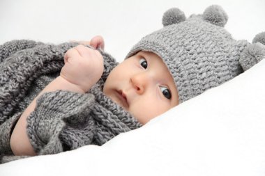 Baby in gray hat clipart