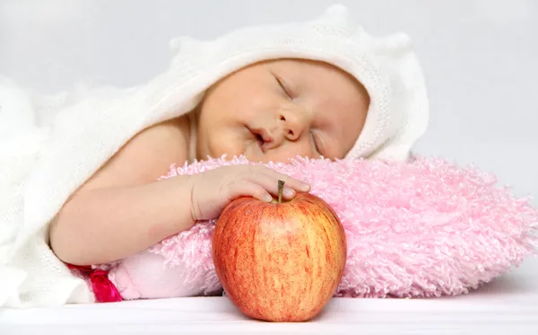 Baby with apple — Stock Photo, Image