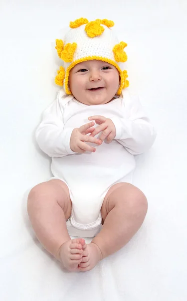 Beautiful happy baby in knitted hat — Stock Photo, Image