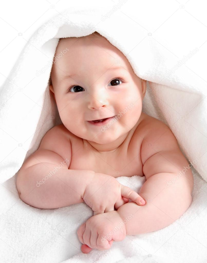 Baby under white blanket Stock Photo by ©nikkos 22875522