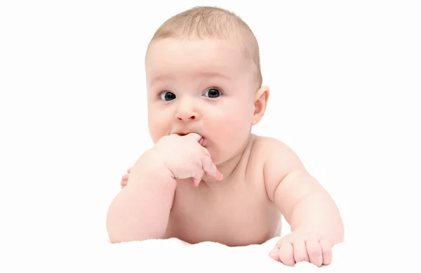 Beautiful baby lies on white blanket — Stock Photo, Image