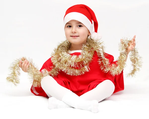 Criança feliz em chapéu de santa claus — Fotografia de Stock