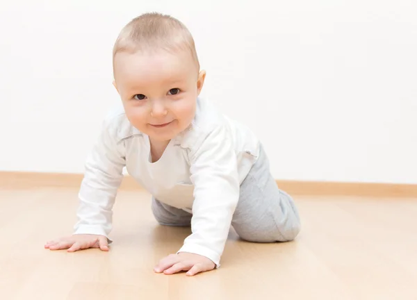 Happy baby crawling Stock Picture