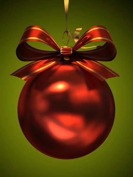 Red christmas ball isolated on green background — Stock Photo, Image