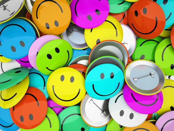 Кнопки з різнокольоровими посмішками — стокове фото