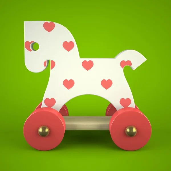 Wood toy horse on green background — Stock Photo, Image