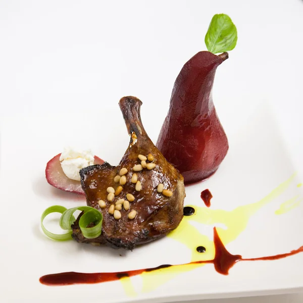 Roasted duck leg with pear — Stock Photo, Image