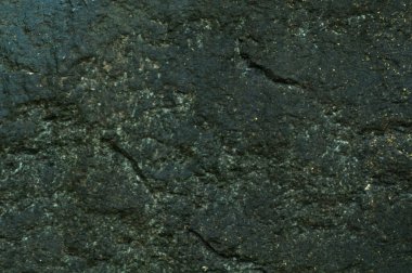 Taş gibi. Koyu taşın arka plan dokusu yakın plan. Üst manzara, Poti 'deki setten taş..