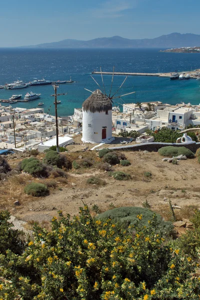 White windmill and Mykonos town, the island of Mykonos — Stock Photo, Image