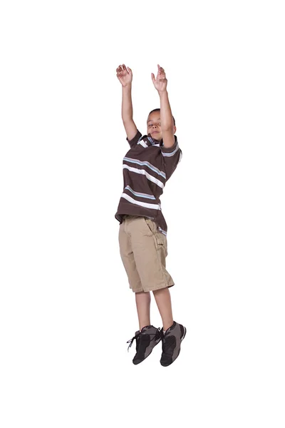 Young boy jumping over white background — Stock Photo, Image