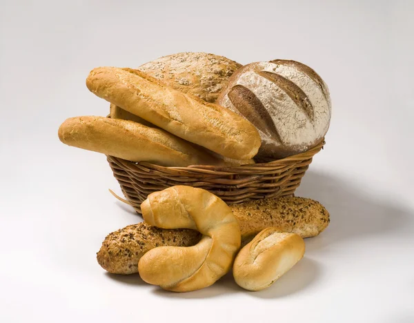 Various types of bread in a basket — Stock Photo, Image