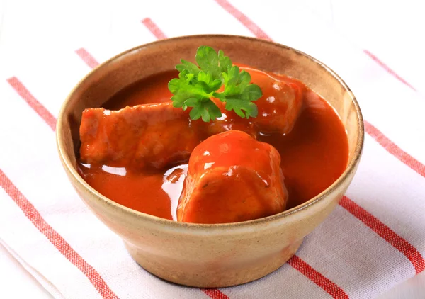 Pork meat in tomato sauce — Stock Photo, Image