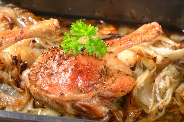 Roast duck legs with caraway and onion — Stockfoto