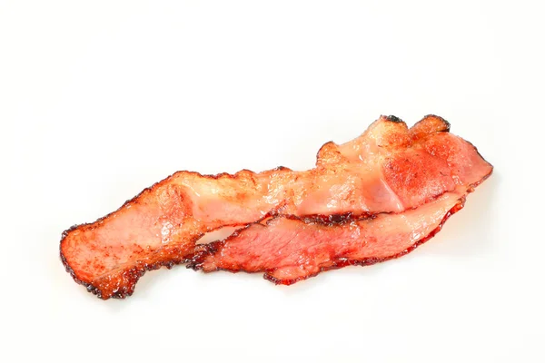 Pan fried bacon strips — Stock Photo, Image