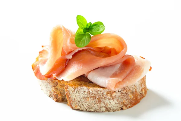 Bread with prosciutto — Stock Photo, Image