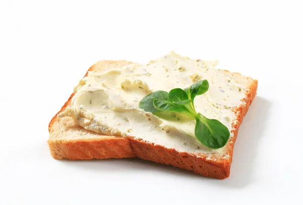 White bread with cheese spread — Stock Photo, Image