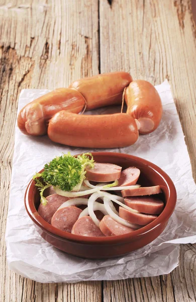 Sliced sausages and onion — Stock Photo, Image