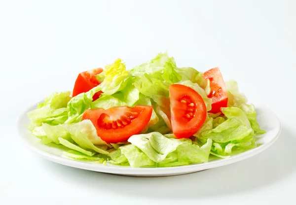 Ice lettuce and tomato wedges Stock Picture