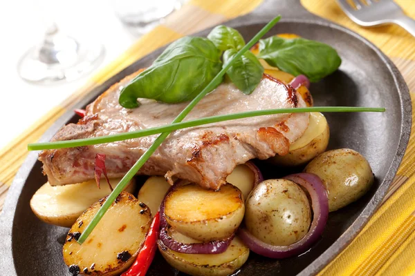 Roasted pork chop and potatoes — Stock Photo, Image
