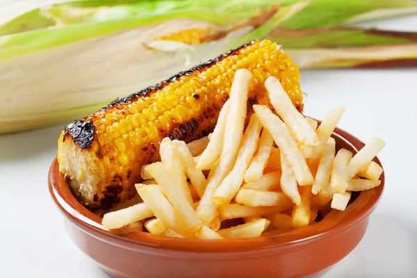 Grilled corn with French fries — Stock Photo, Image